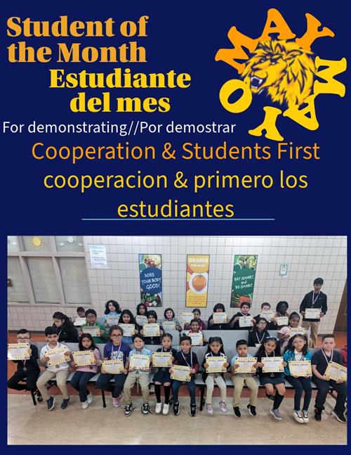 Students holding their student of the month certificates.